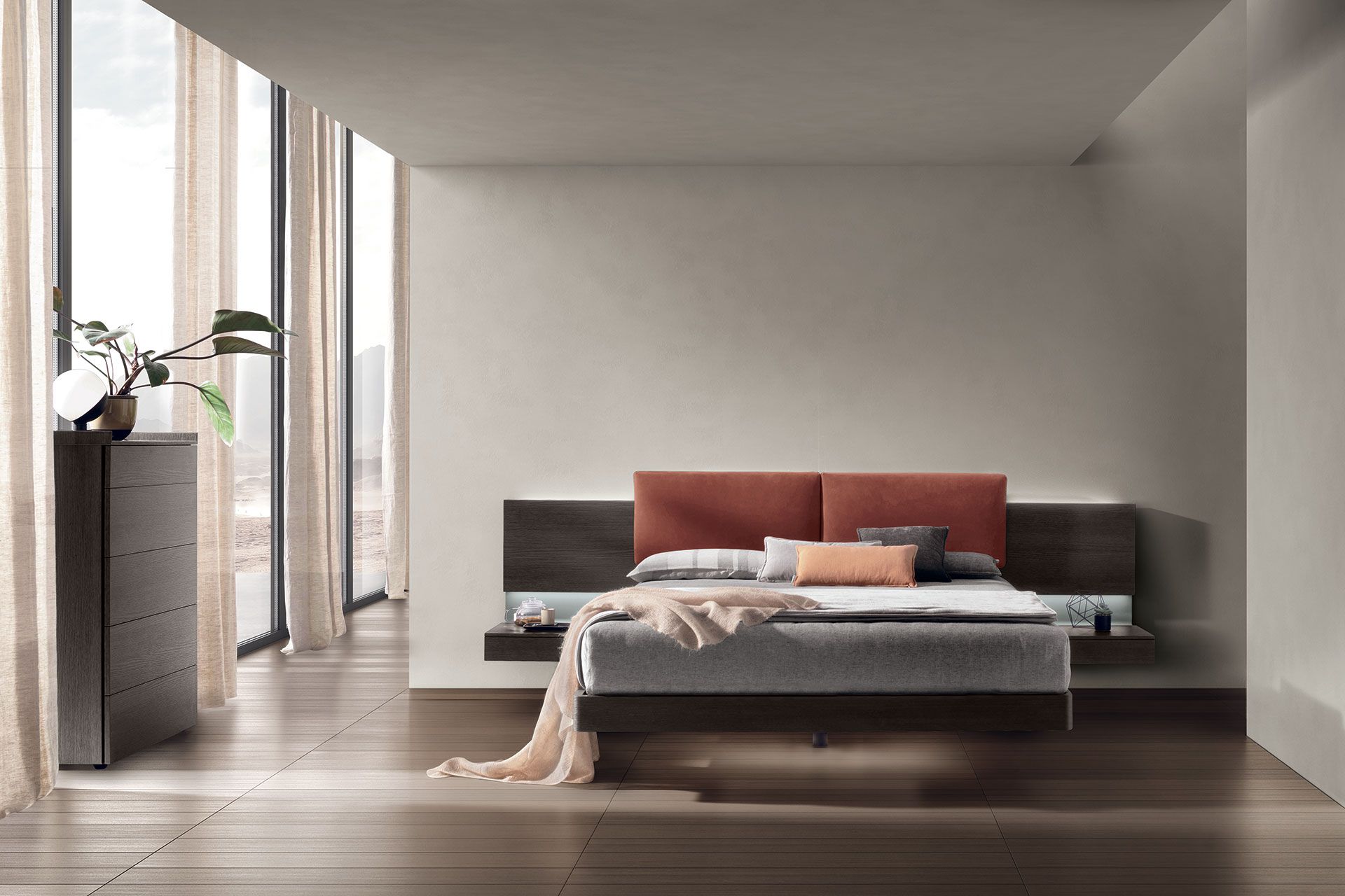 Una camera da letto con un letto grande e tante finestre