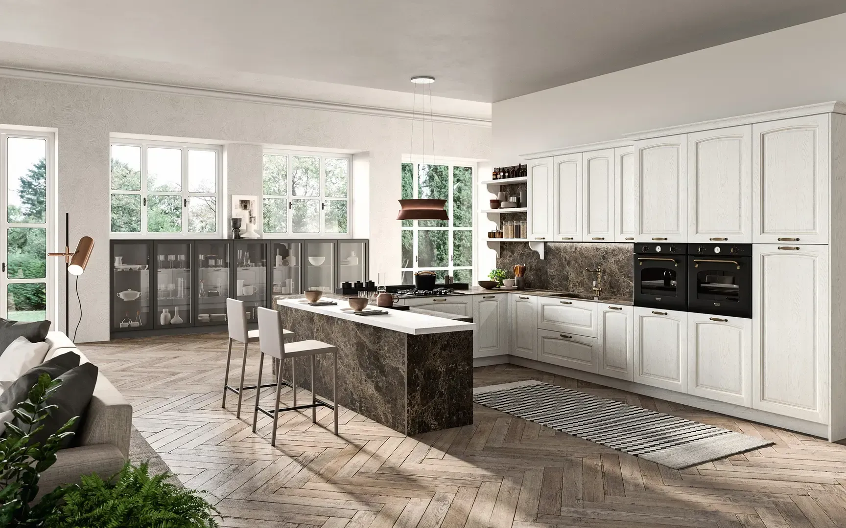 Una cucina con mobili bianchi e una grande isola al centro della stanza.