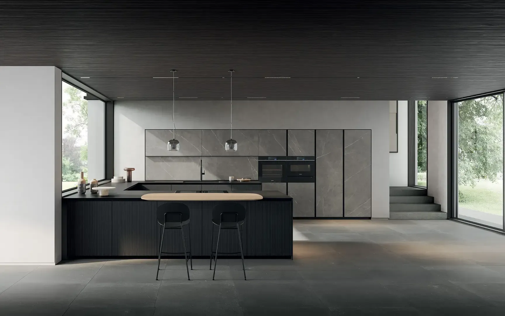 Una cucina con una grande isola e sgabelli