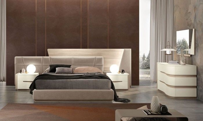 Una camera da letto con un letto grande e una cassettiera