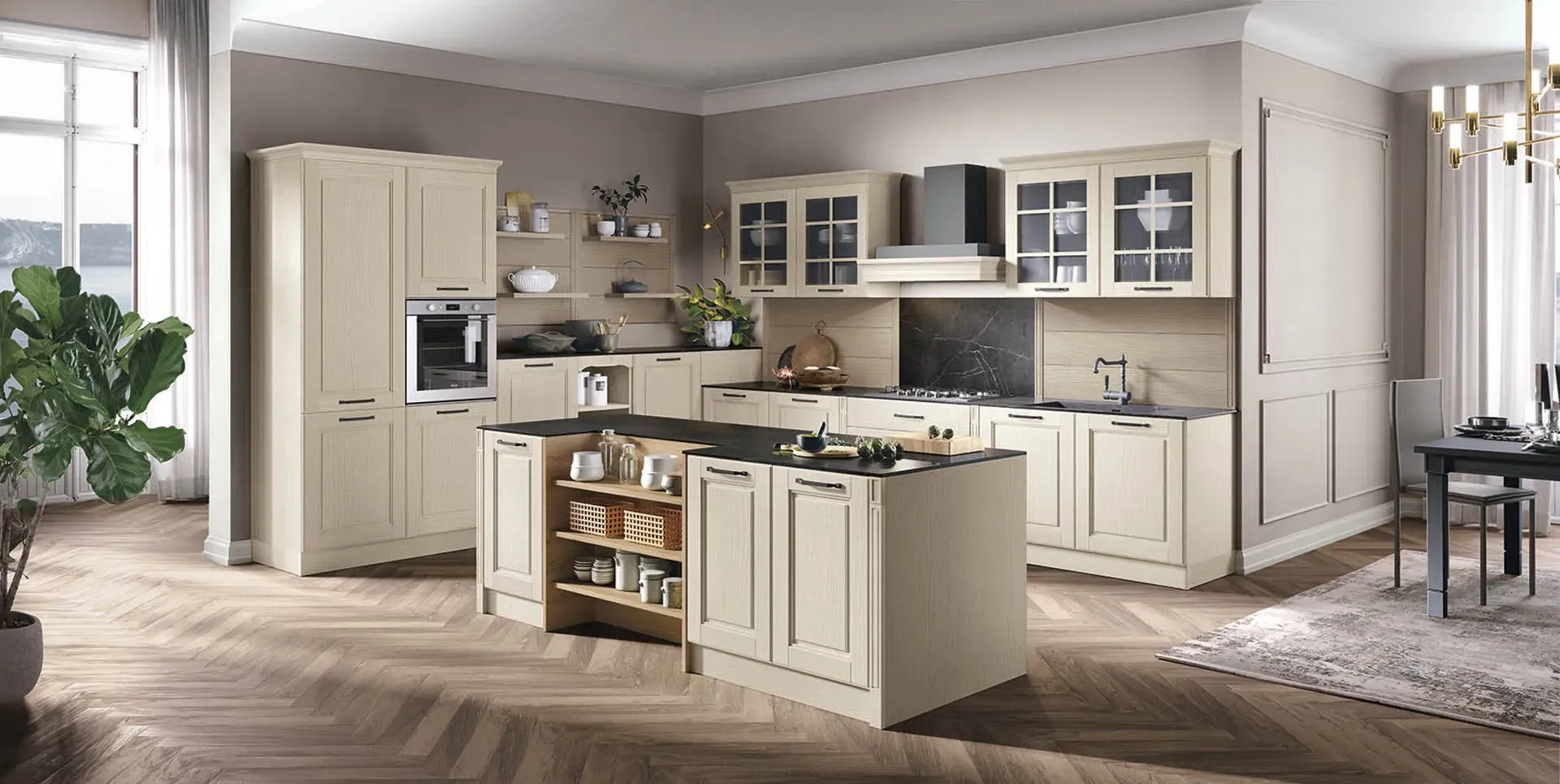 Una cucina con mobili bianchi e un piano di lavoro nero