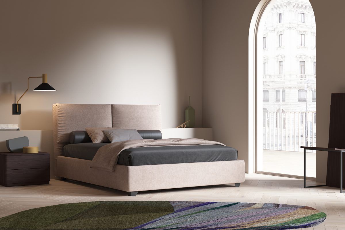 Una camera da letto con un letto, un comodino e un tappeto