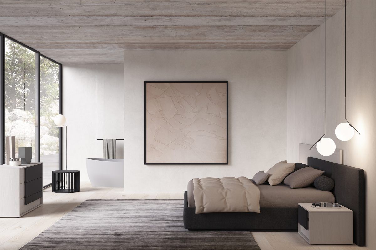 Una camera da letto con un letto, comodini e un quadro sul muro.