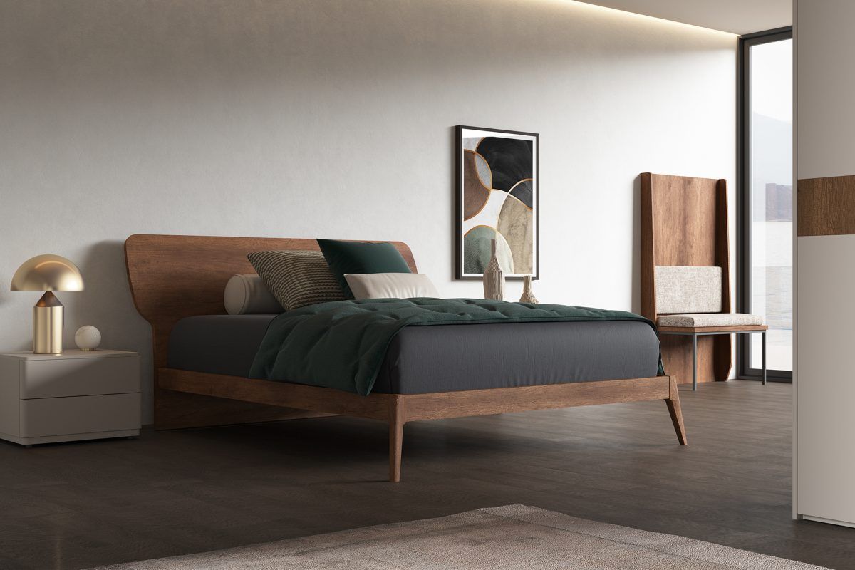 Una camera da letto con un letto, un comodino e una lampada