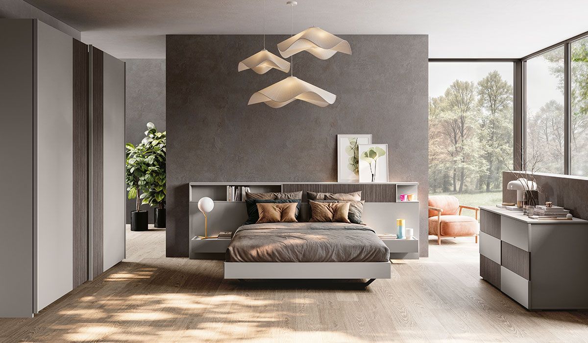 Una camera da letto con un letto grande e una cassettiera