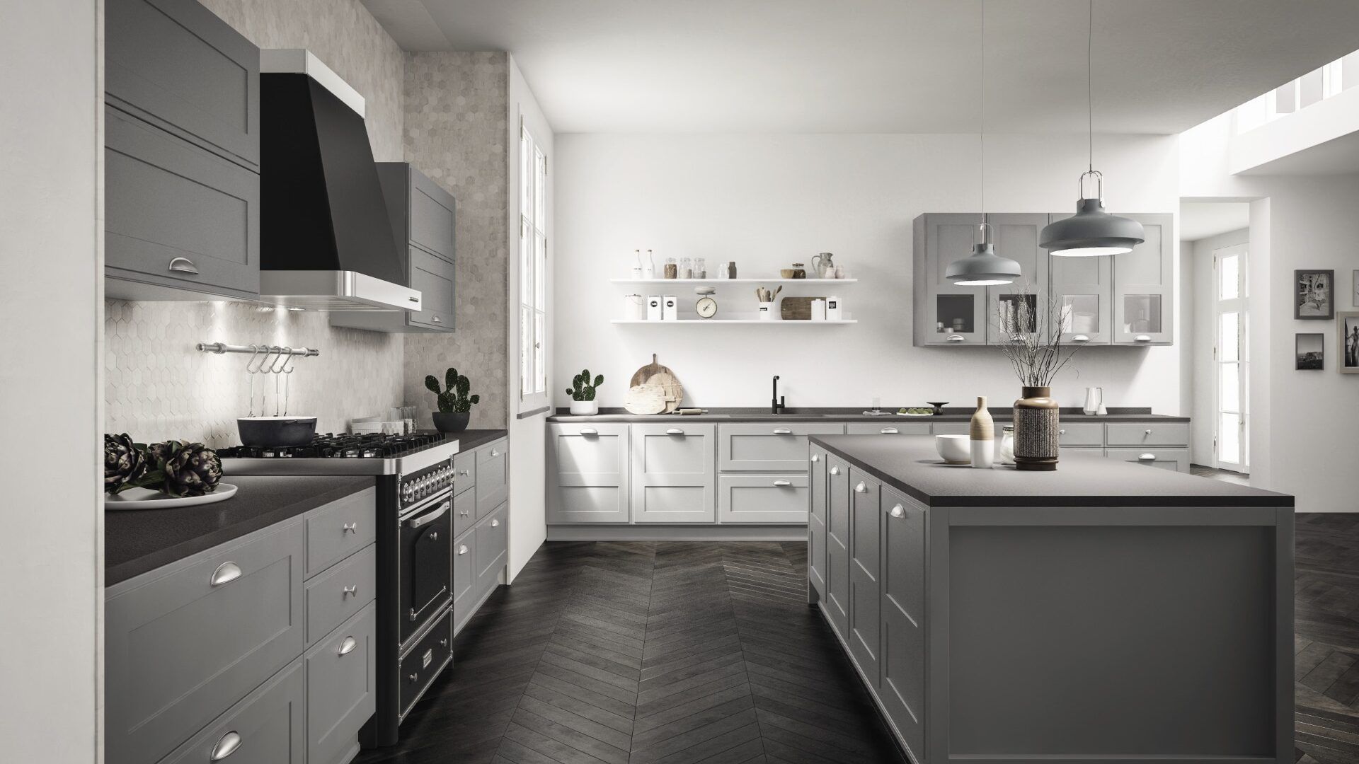 Una cucina con mobili grigi e ripiani neri e una grande isola al centro.