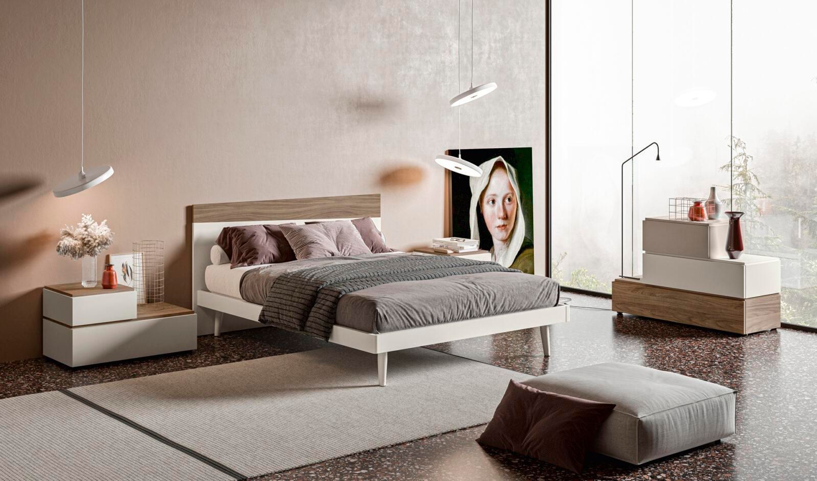 Una camera da letto con un letto, comodini e un dipinto sul muro