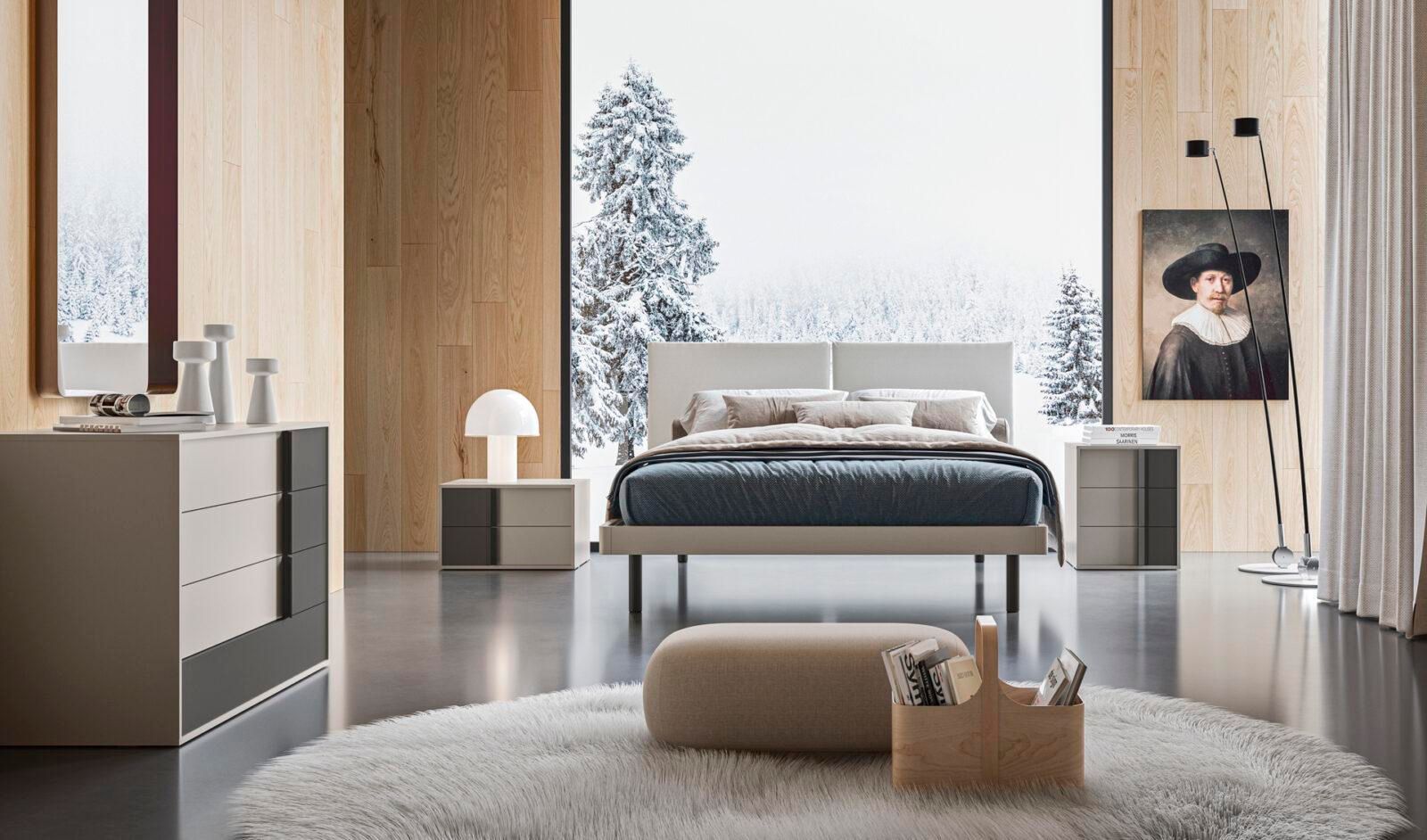 Una camera da letto con un dipinto sul muro sopra il letto