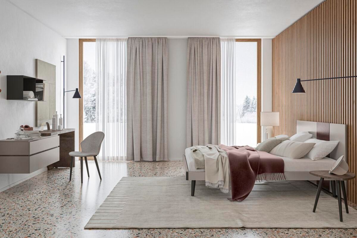 Una camera da letto con un letto, una scrivania, una sedia e un tappeto.