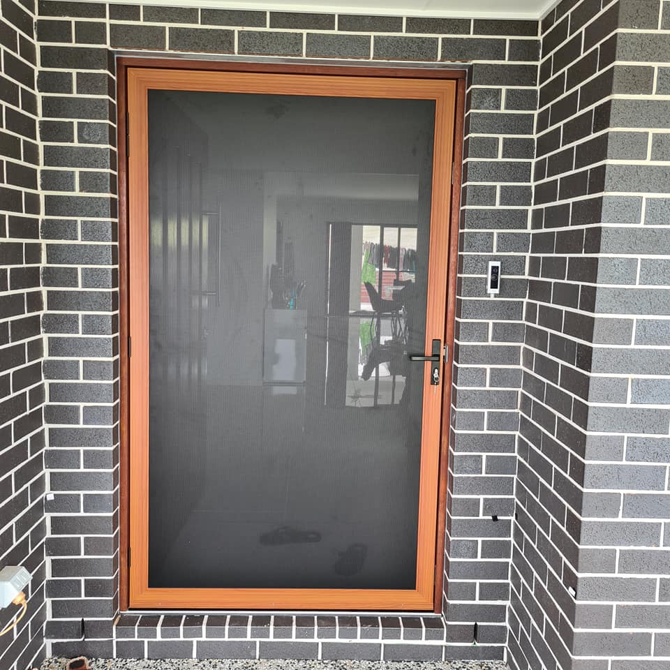 A Brick House with Screen Door — Quality Custom Screens in Caloundra, QLD