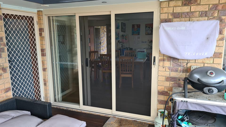 A White Sliding Door with Screen Door — Quality Custom Screens in Caloundra, QLD