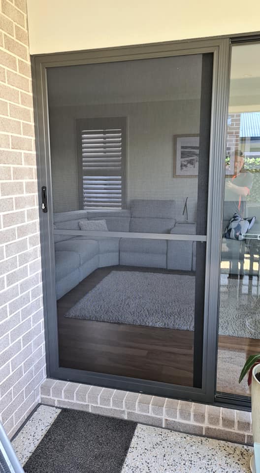 A Wide Door with Black Screen — Quality Custom Screens in Caloundra, QLD