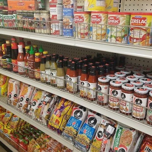 A grocery store shelf filled with a variety of food items