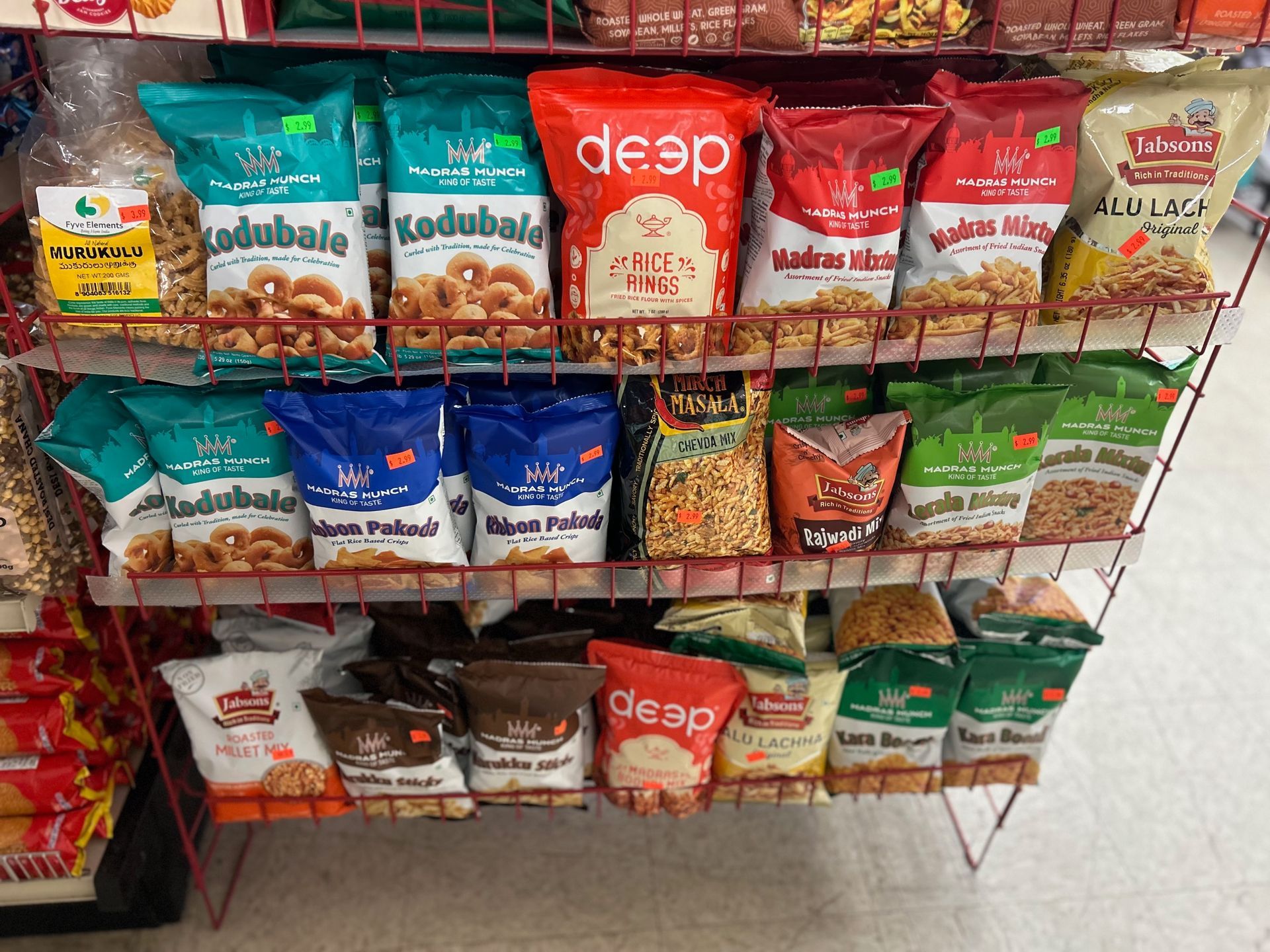 A shelf filled with bags of food including desp