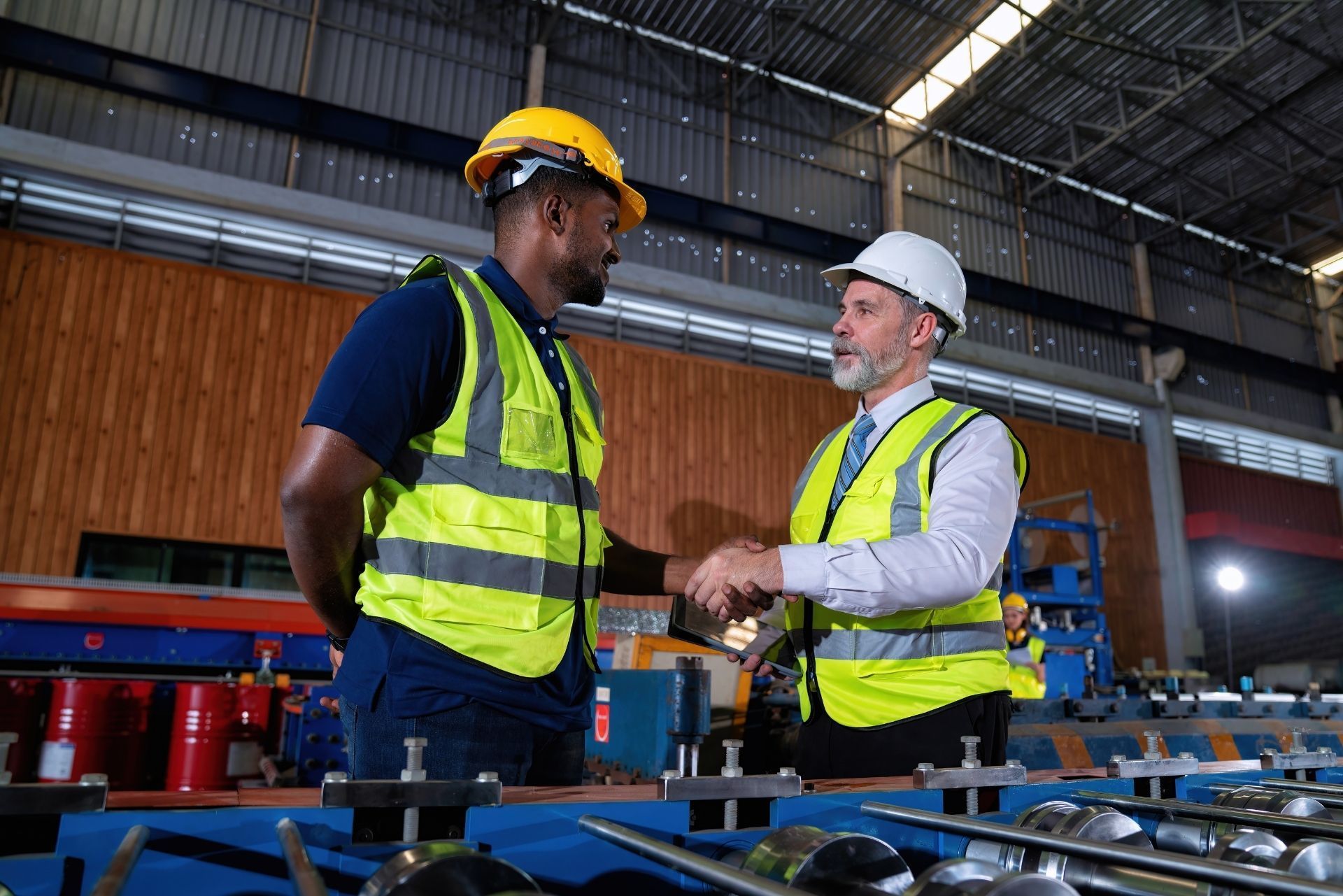 HVAC technician wearing mask and hard hat, working on AC units on a rooftop. HVAC technician wearing mask and hard hat, working on AC units on a rooftop.