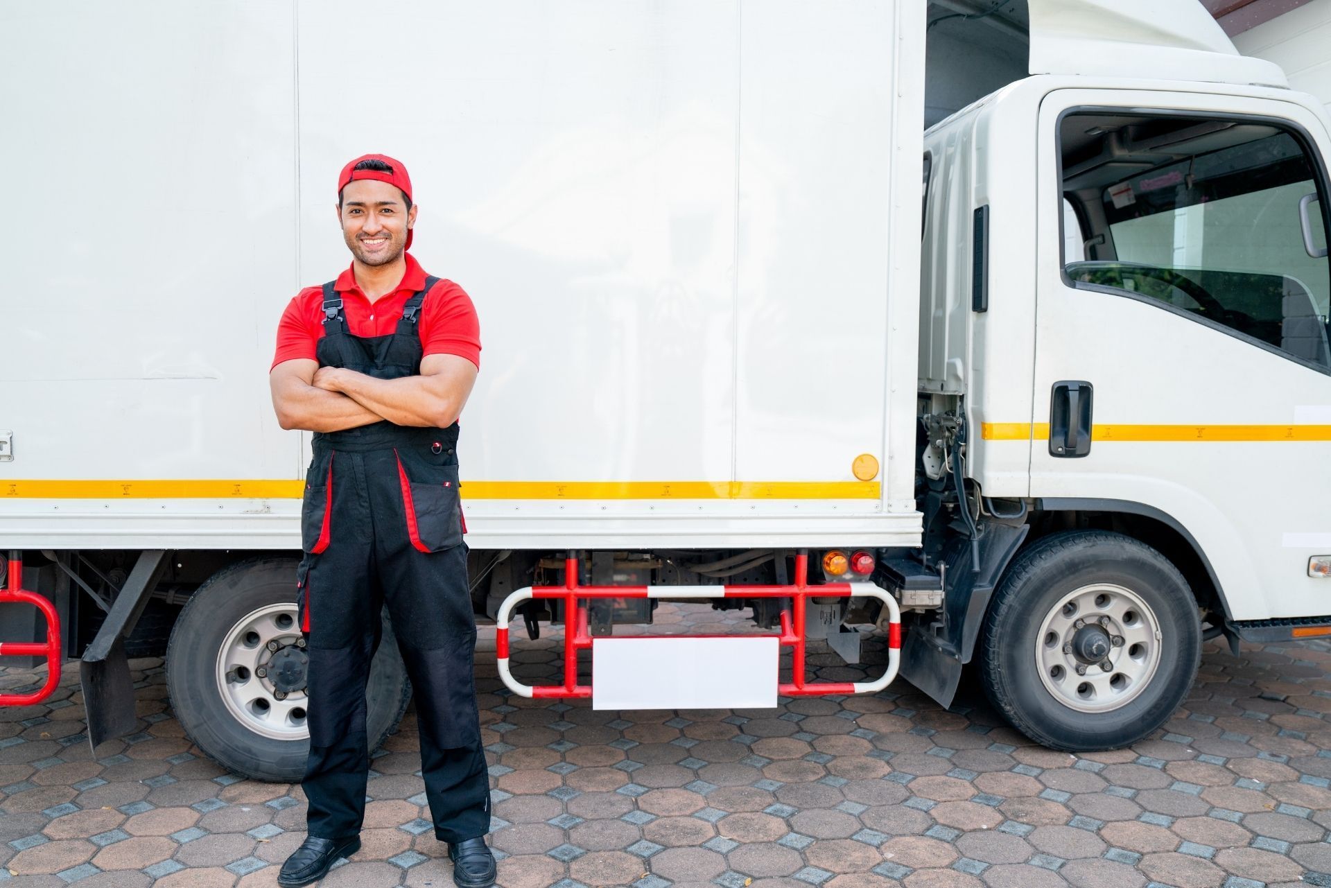 HVAC technician wearing mask and hard hat, working on AC units on a rooftop. HVAC technician wearing mask and hard hat, working on AC units on a rooftop.