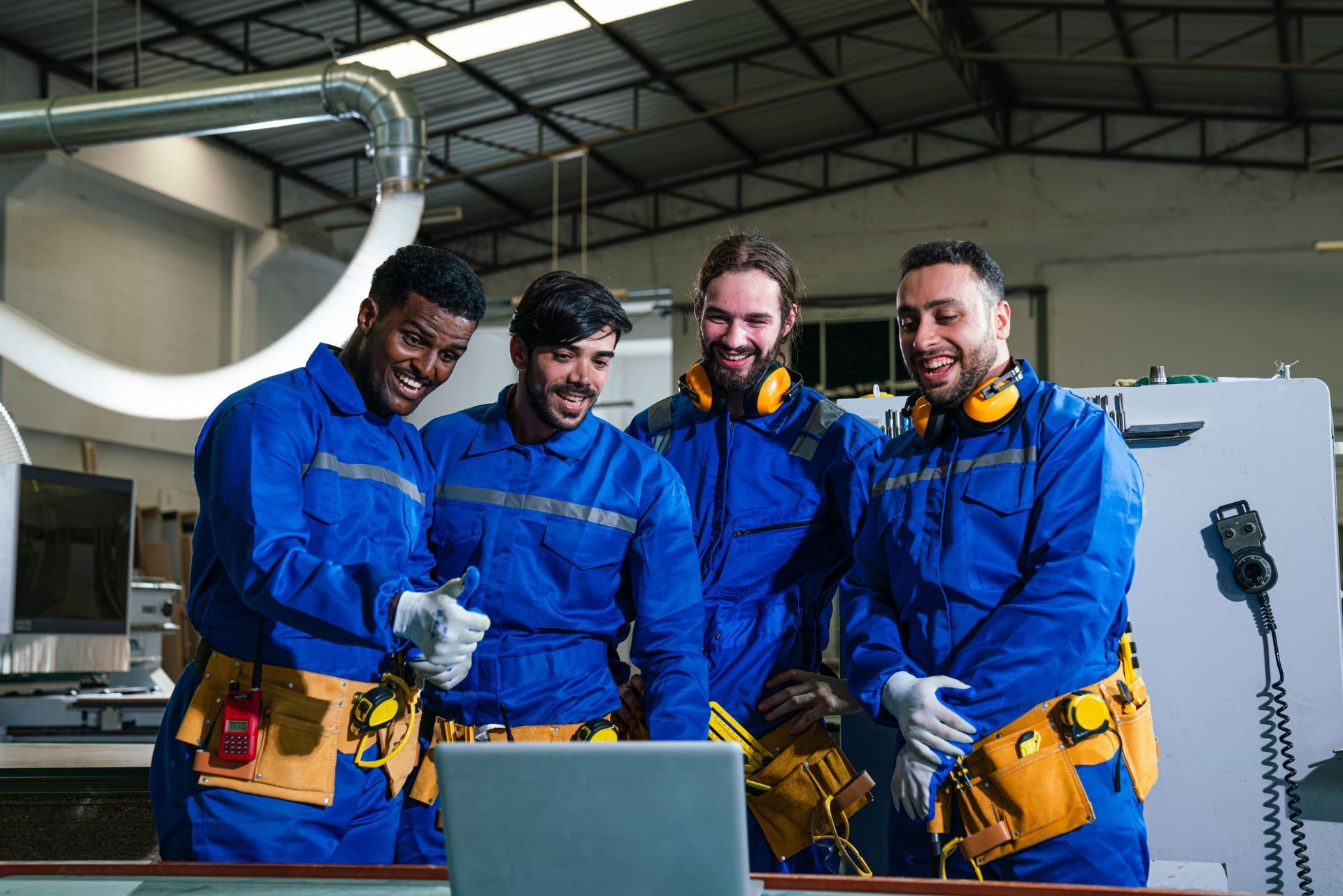 HVAC technician wearing mask and hard hat, working on AC units on a rooftop. HVAC technician wearing mask and hard hat, working on AC units on a rooftop.