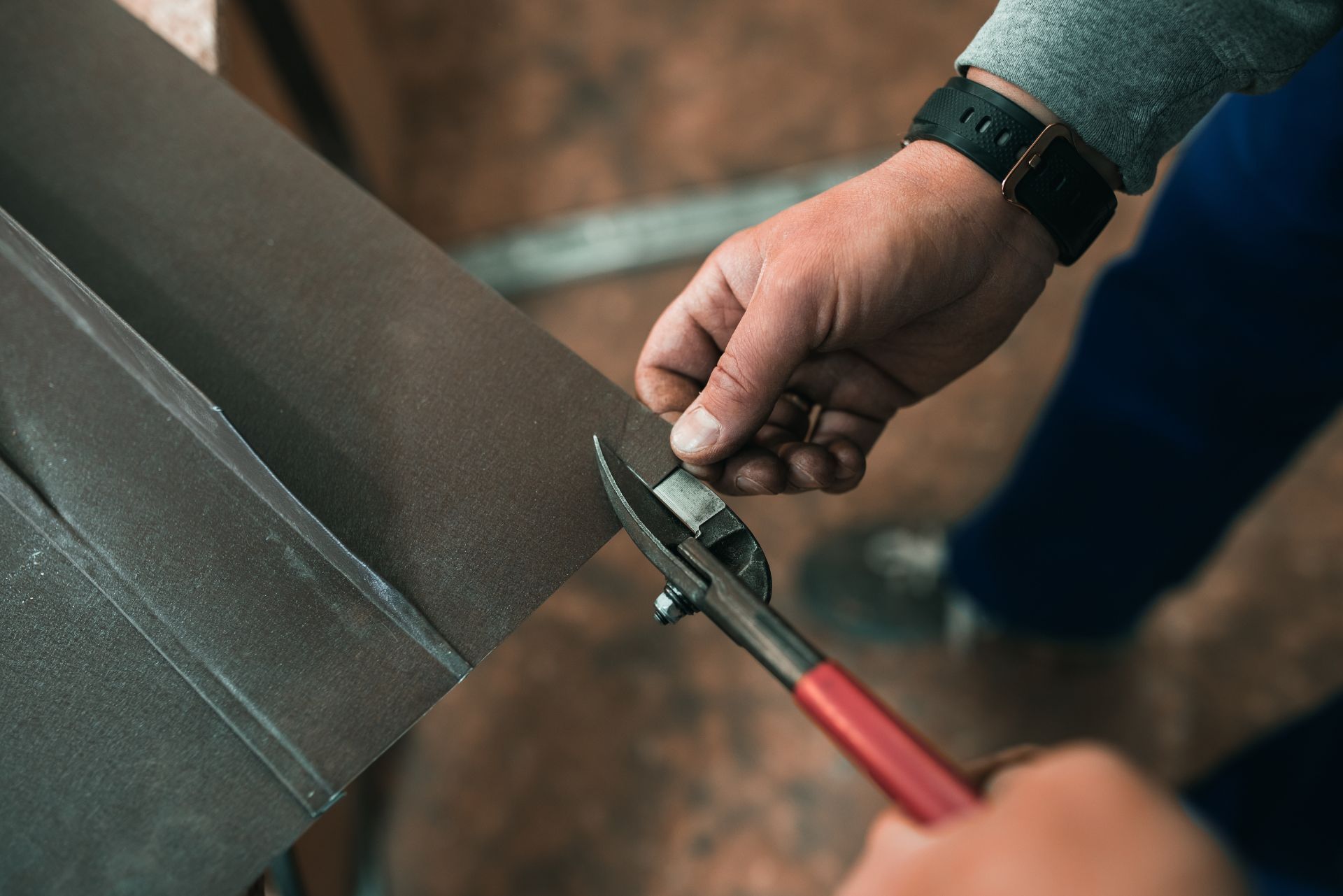 HVAC technician wearing mask and hard hat, working on AC units on a rooftop. HVAC technician wearing mask and hard hat, working on AC units on a rooftop.