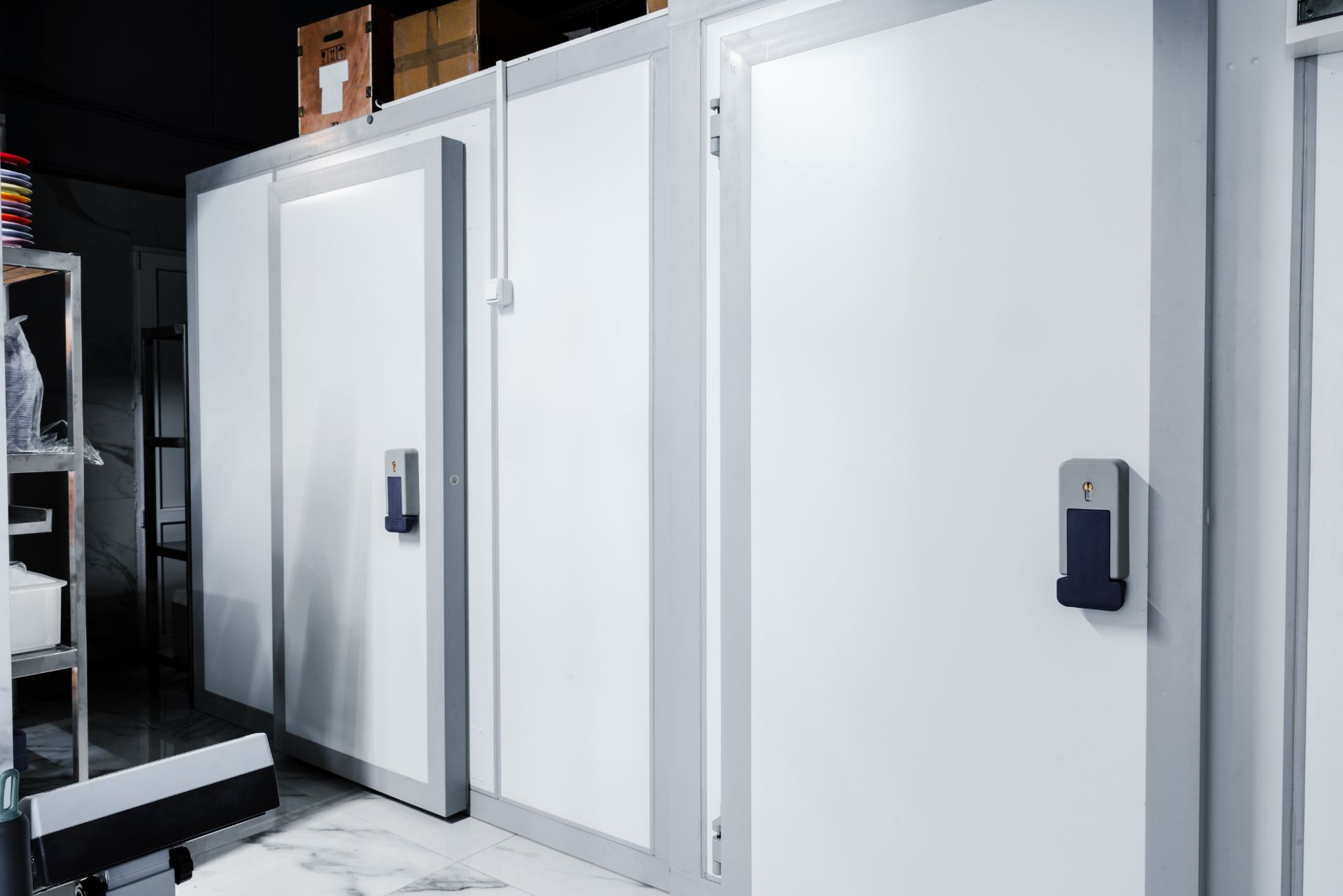 HVAC technician wearing mask and hard hat, working on AC units on a rooftop.