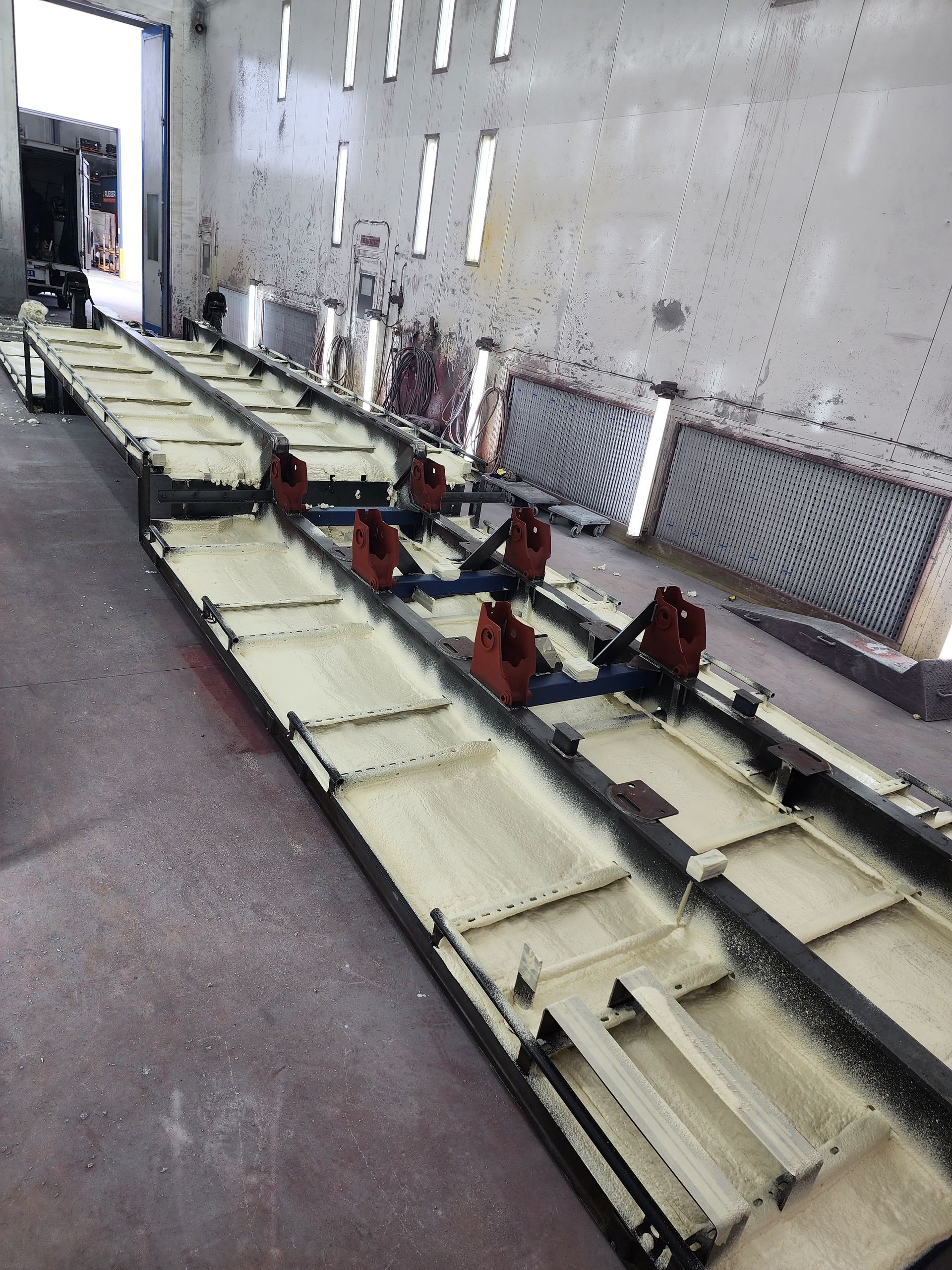 A Worker While Sitting Is Spraying a Foam Insulation Perspective View | Pakenham, Vic | Advanced Foam & Coatings Pty Ltd