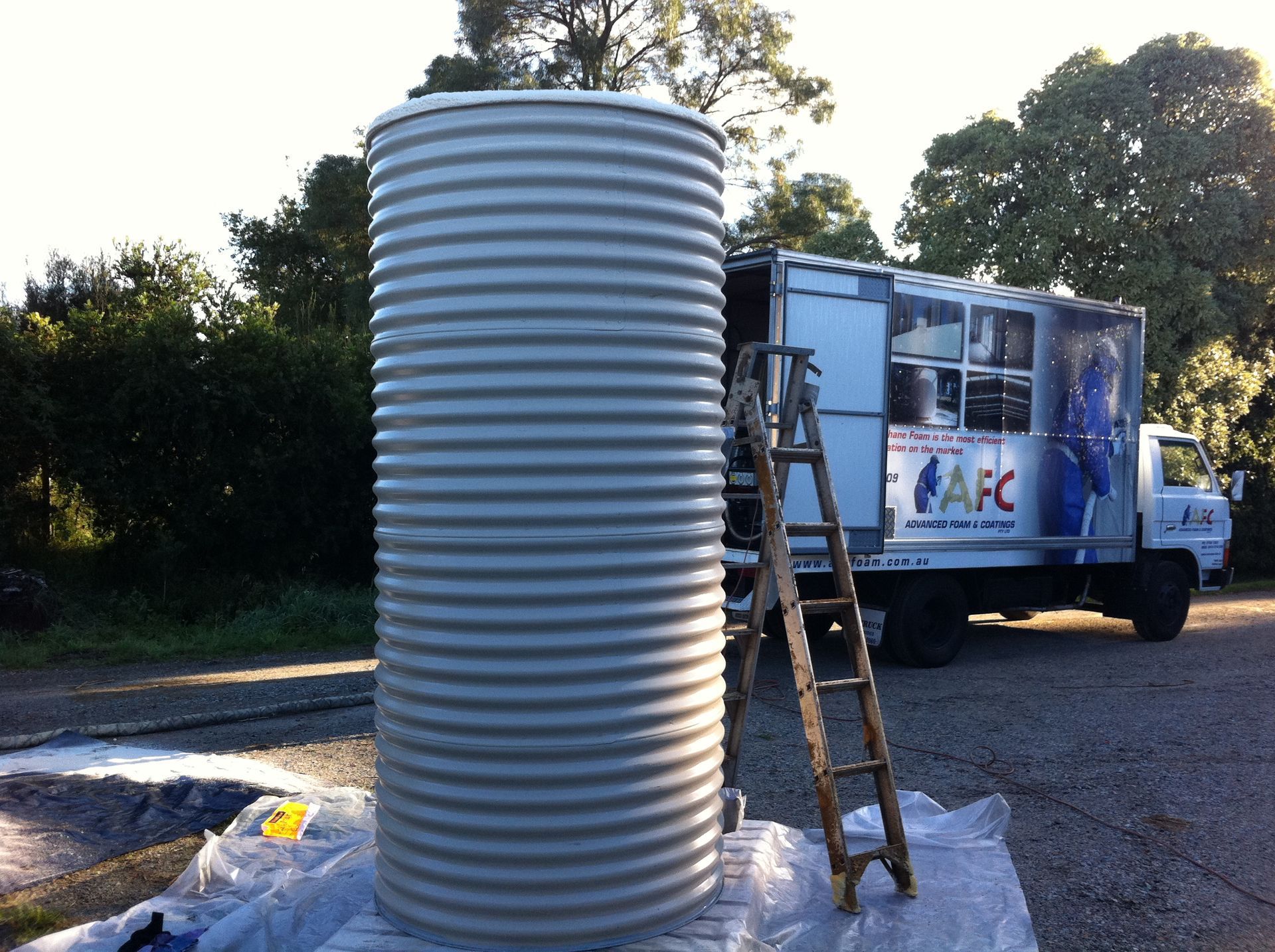 A Man Spraying Insulation Foam in a Vessel | Pakenham, Vic | Advanced Foam & Coatings Pty Ltd