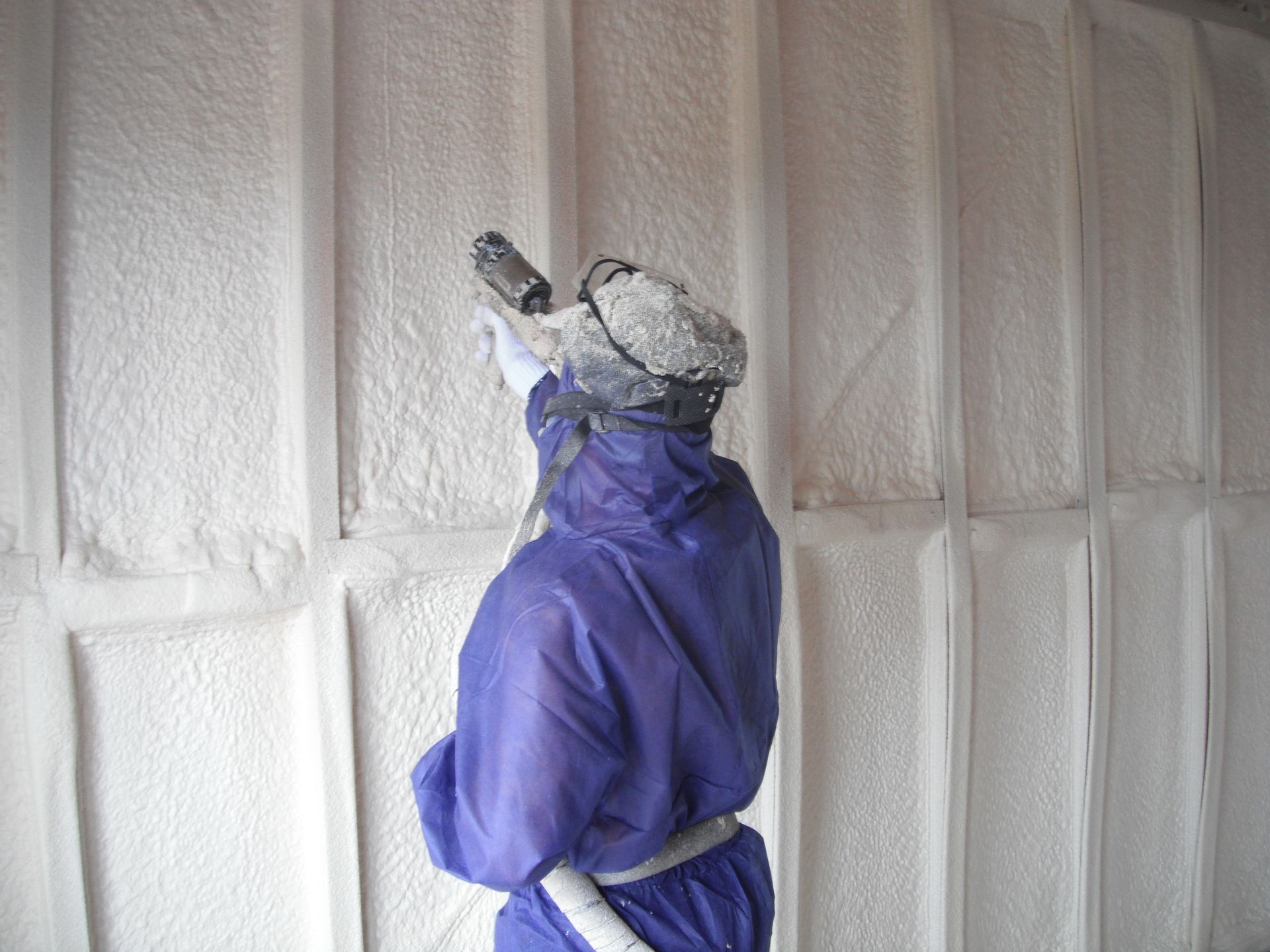 A Man Face into the Wall with Orange Clothes and Black Cup | Pakenham, Vic | Advanced Foam & Coatings Pty Ltd