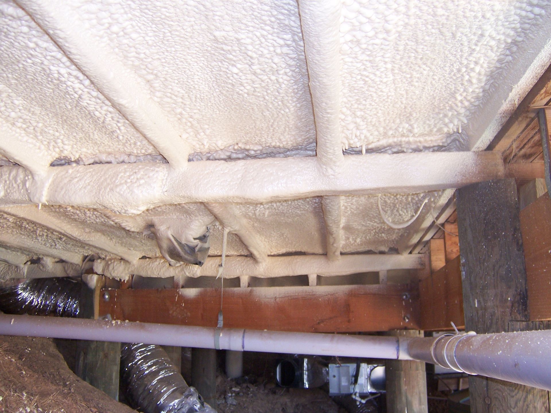 A Man Spraying an Underfloor Insulation Side View | Pakenham, Vic | Advanced Foam & Coatings Pty Ltd