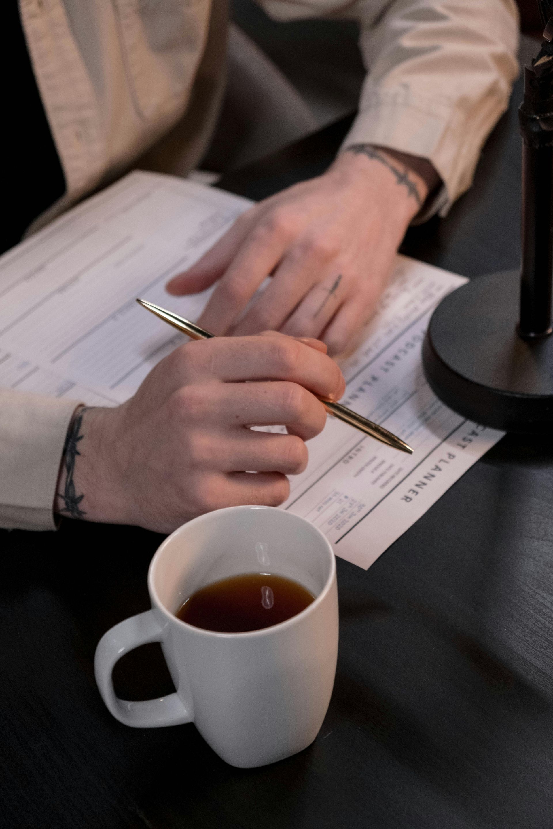 Close-up of a recruiter analyzing a precision-engineered executive document for leadership placement.