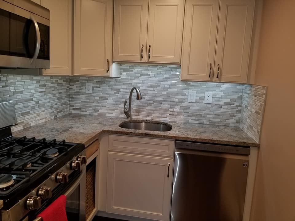 Flooring Installation — Granite Countertop with Brick Walls in Wilmington, DE