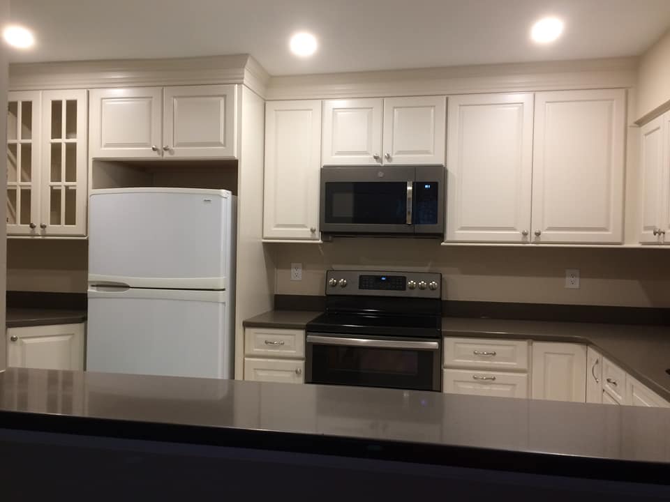Cabinets — White Cabinets with White Refrigerator in Wilmington, DE