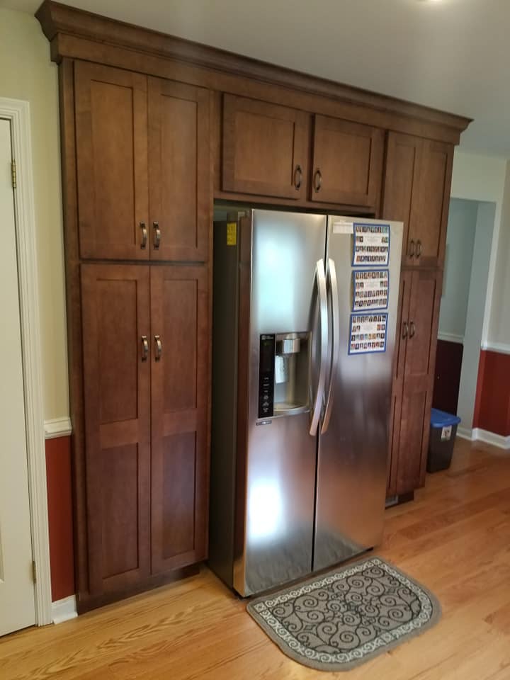 Countertop Installation — Wooden Cabinets Between the Refrigerator in Wilmington, DE