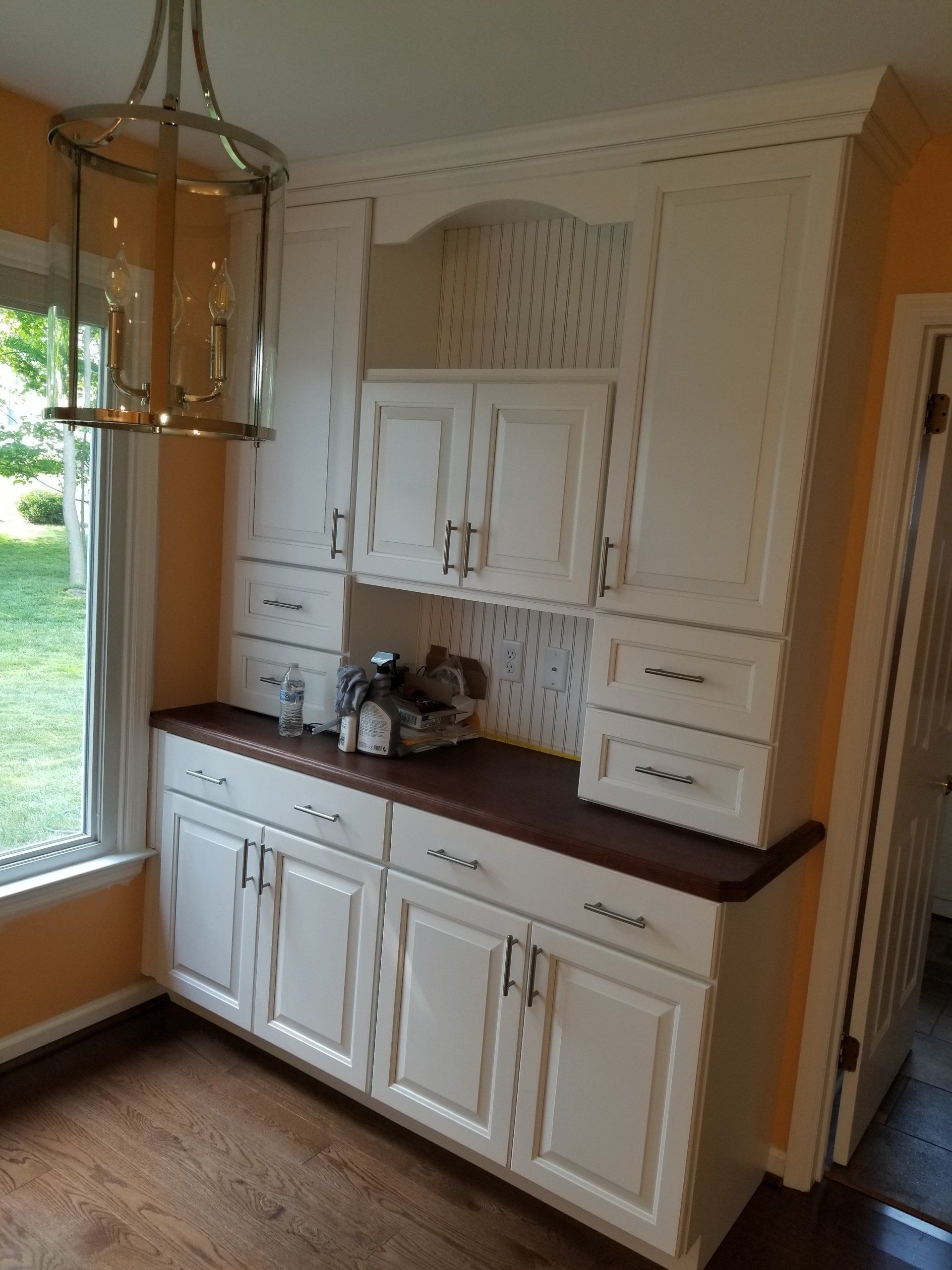 Countertops — White Cabinet with Glass Chandelier in Front in Wilmington, DE