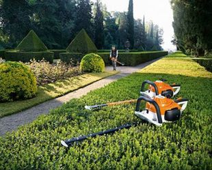 Picture of Hedge Trimming Tools, and guy trimming bushes and Shrubs.
