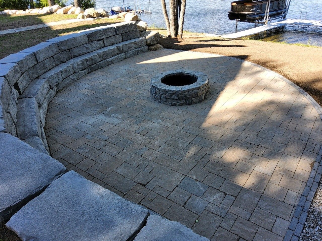 There is a fire pit in the middle of the patio.