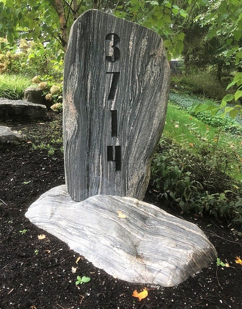 A large rock with the number 3 carved into it.