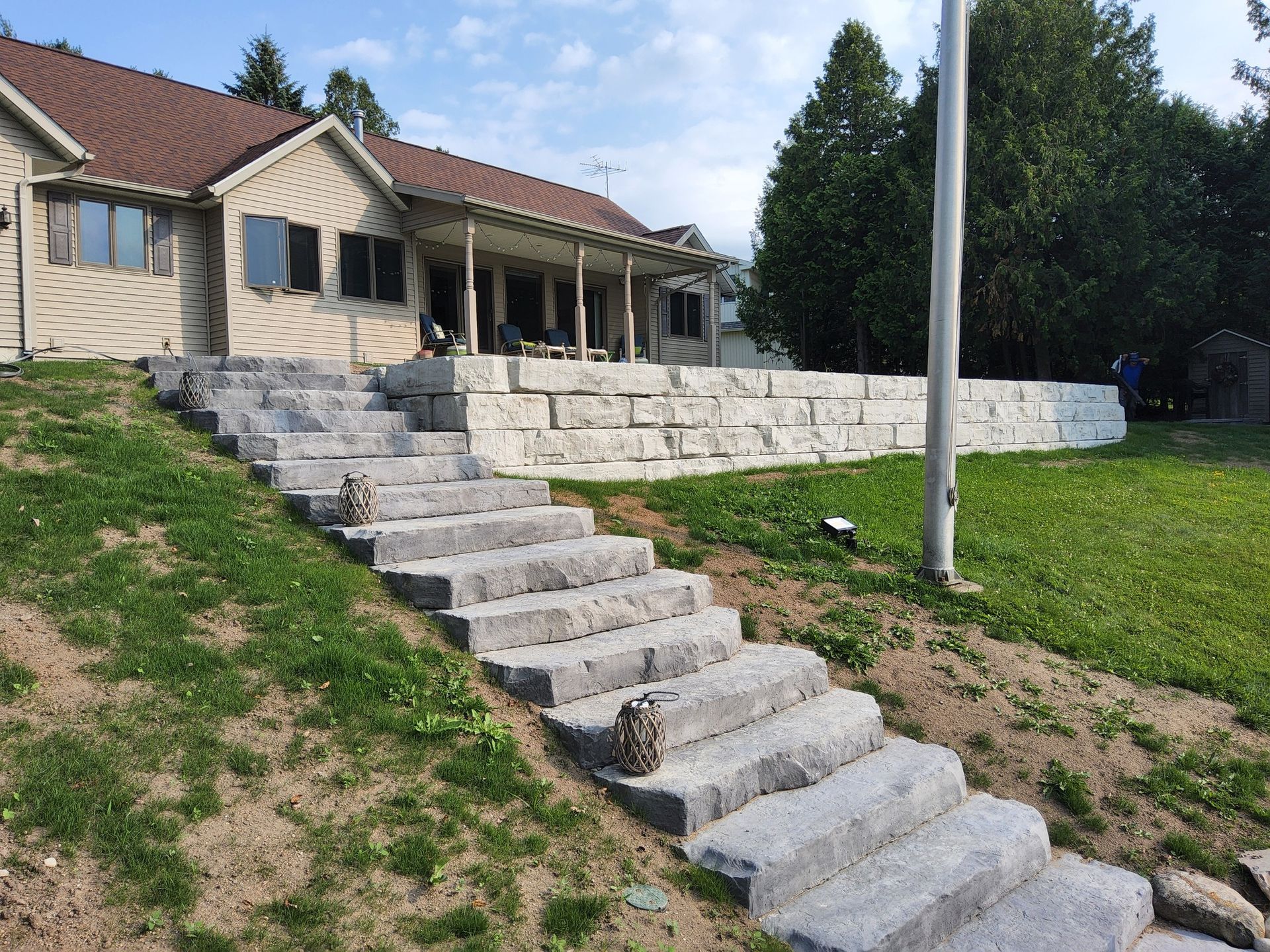 A set of stairs leading up to a house on a hill.
