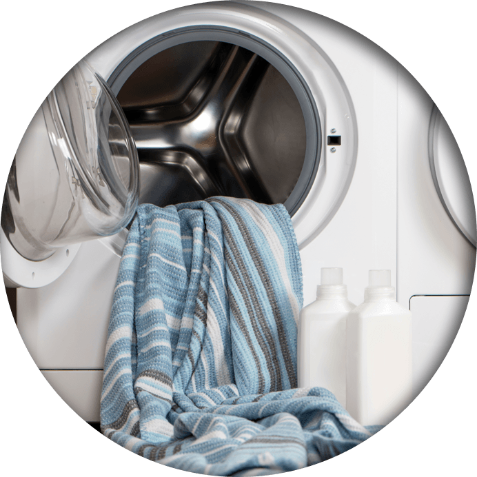 A blanket inside an open washing machine