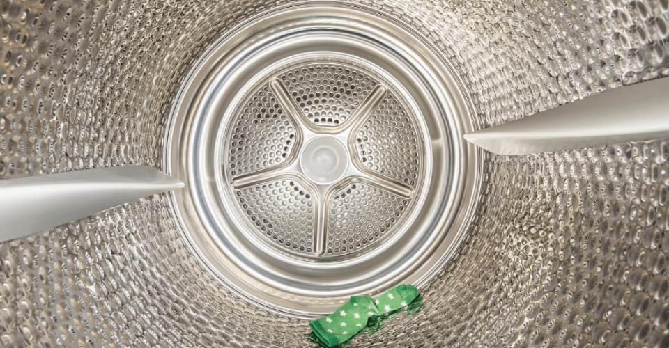 a green piece of cloth inside the dryer drum
