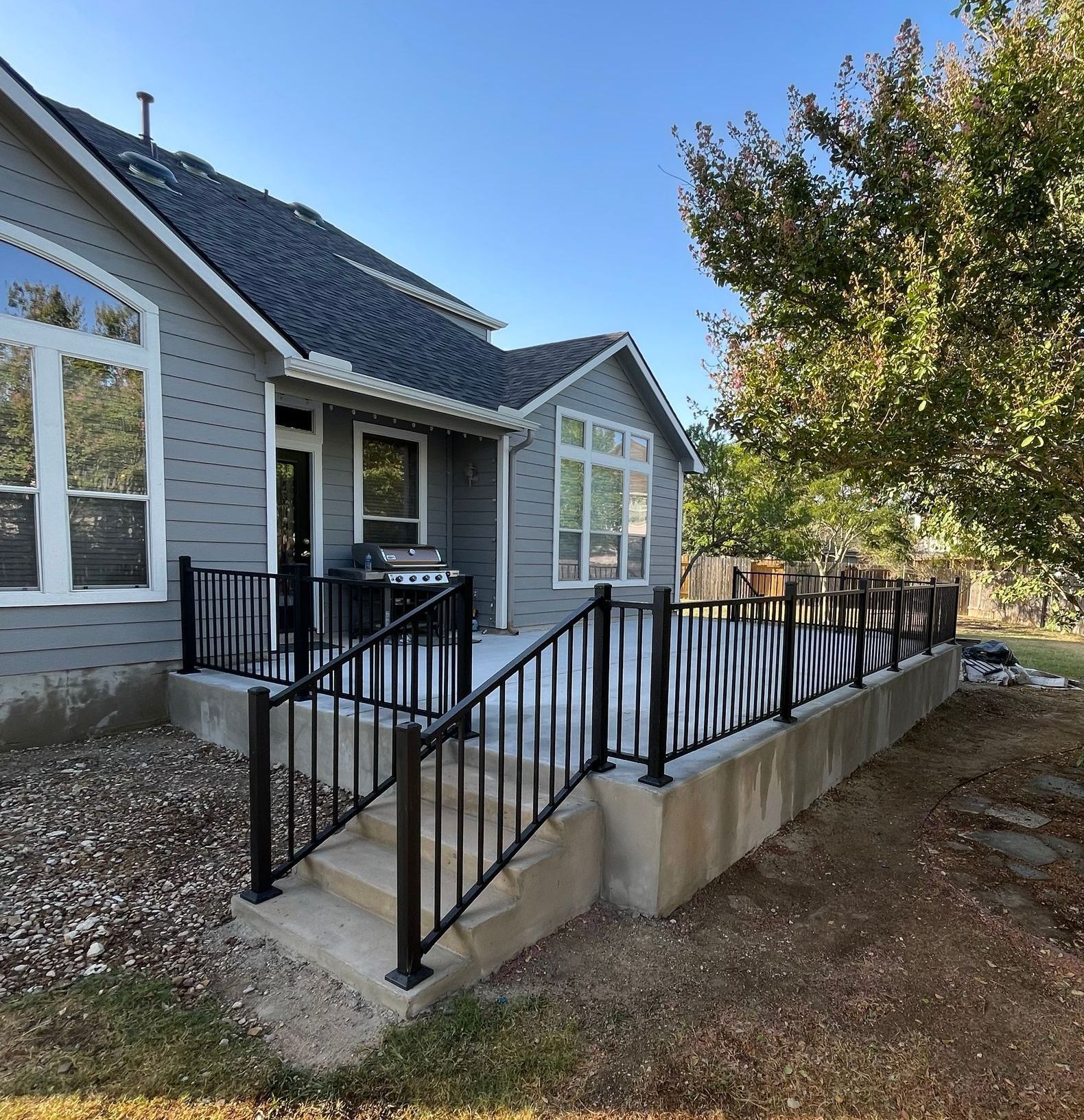 black railing on concrete patio