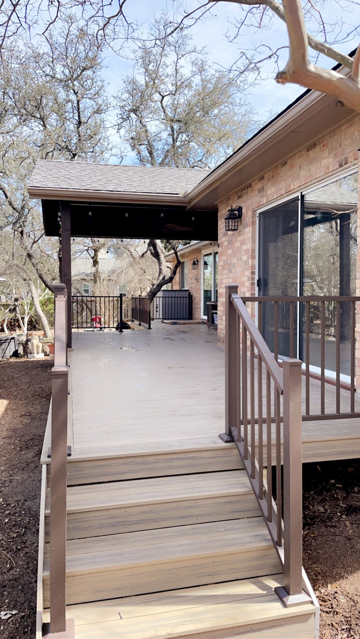 composite deck with brown custom metal railing