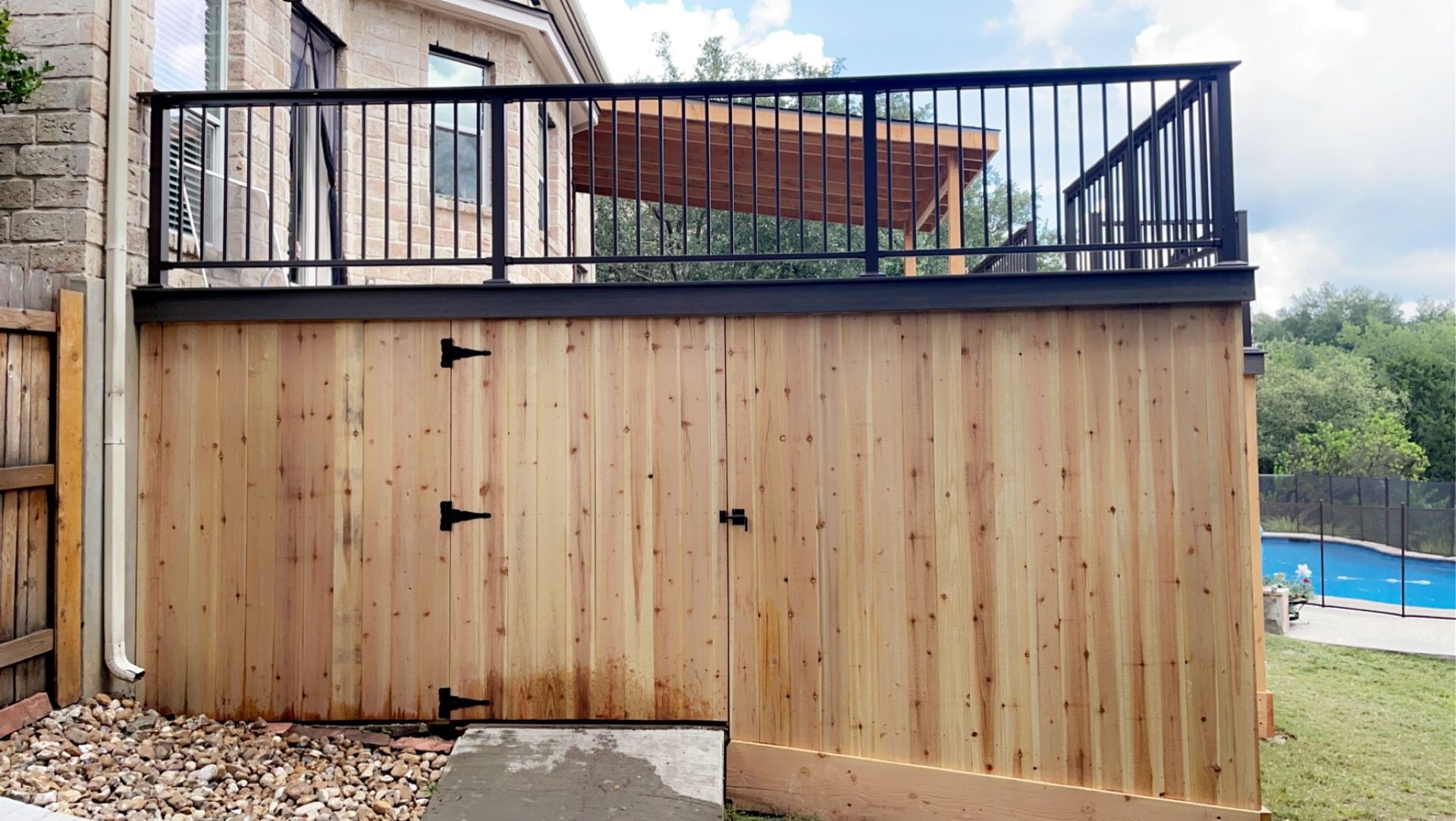 Raised deck with under-deck storage and cedar skirting