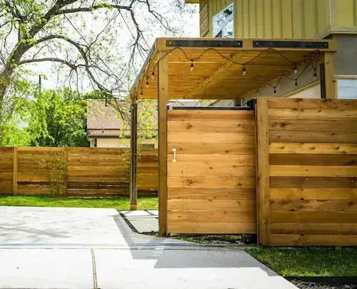 back yard roof cover with rustic privacy wall 