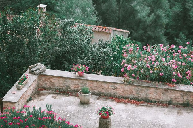 stone patio and wall with flowers