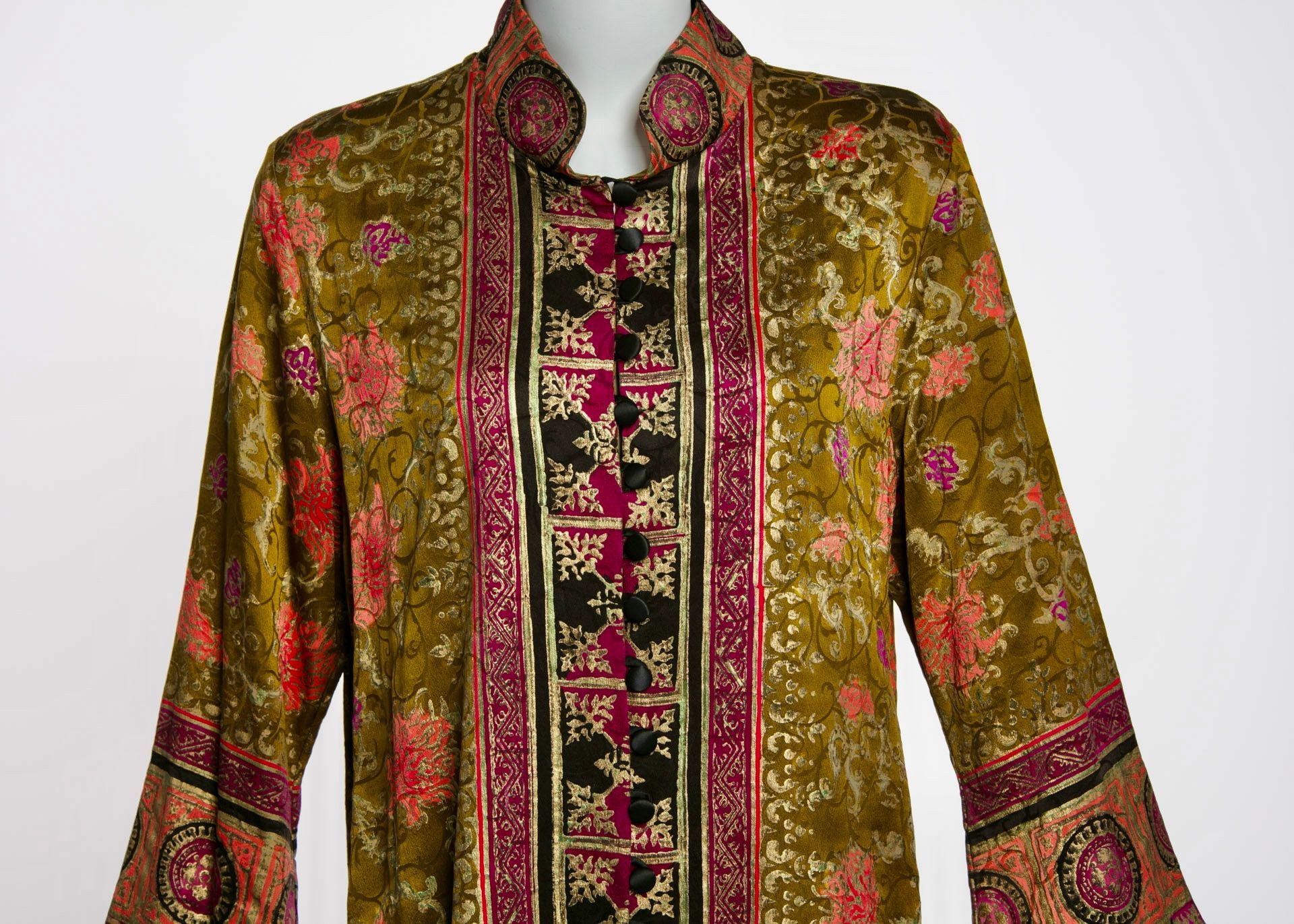 Green and red floral patterned jacket with black and red accents.
