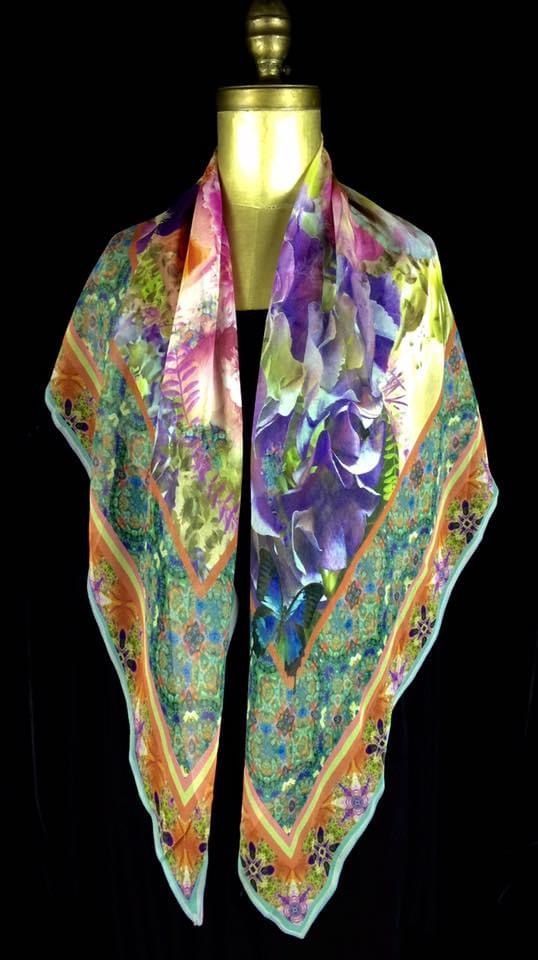 Silk scarf with floral and paisley designs in shades of purple, green, and orange.