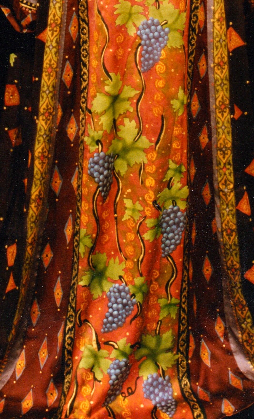 Orange fabric with grape vine pattern.