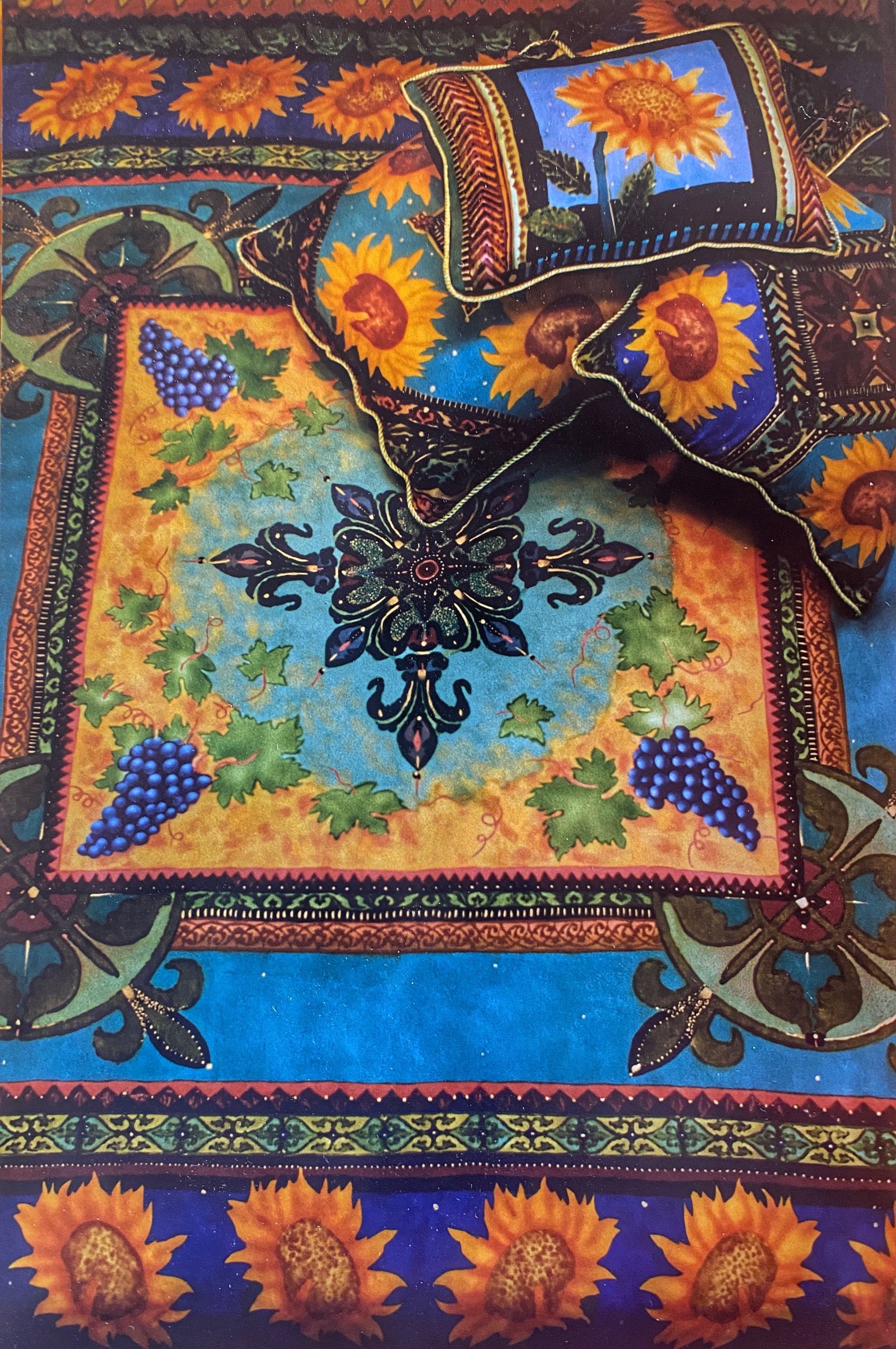 Bedding set with sunflower and grape patterns, blues, golds, and oranges.