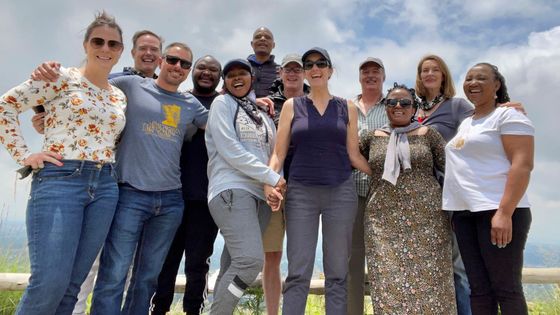 A group of people are posing for a picture together.