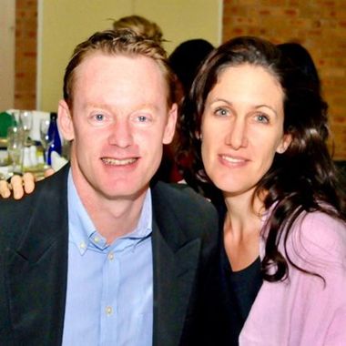 A man and a woman are posing for a picture together