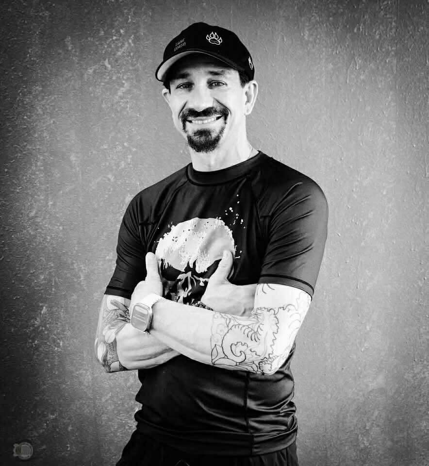 a man and a woman are practicing martial arts on a mat